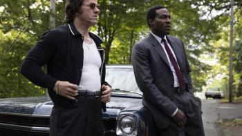 By Any Means Movie: Scarpa and Strider lean on a car, as if preparing to question another witness or suspect