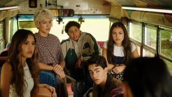 Camp Rock 3 Movie: Sage, Desi, Cliff, Rosie and Fletcher sitting on a colorful school bus, looking towards Lark in disbelief.