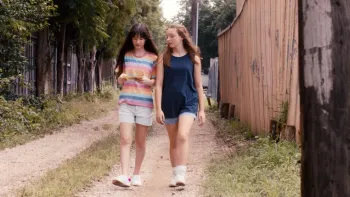 Casey Makes a Mixtape: Kennedy Celeste and Presley Richardson walk down an alley.