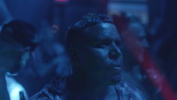 Caterpillar movie: David Taylor stands in a dark nightclub