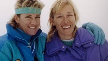 Chris & Martina: The Final Set: Chris and Martina smiling, wearing blue and purple winter jackets, in a snowy setting.
