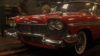Christine Movie: The shiny, red front end of Christine, a 1958 Plymouth Fury