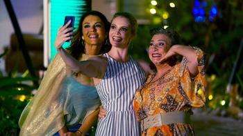 Christmas in the Caribbean: Elizabeth Hurley, Nathalie Cox, and Caroline Quentin pose for a selfie dressed up for an evening out.
