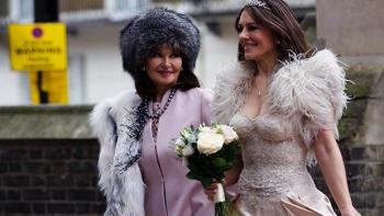 Christmas in the Caribbean: Elizabeth Hurley walks outside in a wedding dress next to Stephanie Beacham, who plays her mother.