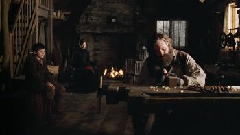The Christmas Miracle of Jonathan Toomey: Tom Berenger carves an item out of wood while Luke Ward-Wilkinson and Joely Richardson watch