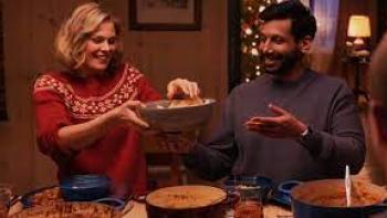 Christmas as Usual scene 3: White woman and Indian man share a meal