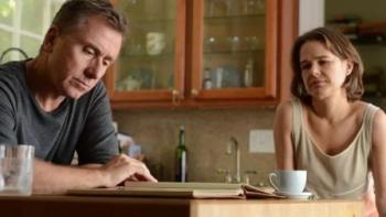 Chronic: A White middle-aged man and woman sit at kitchen table