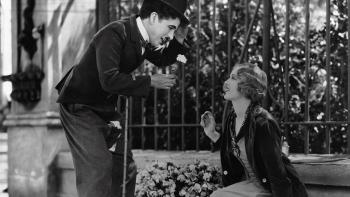 City Lights Movie: Charlie Chaplin offers a woman a flower