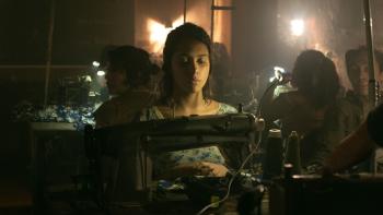City of Dreams Movie: Elena (Renata Vaca) works at a sewing machine in a sweat shop