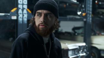 Clika Movie: Chito (Jay Dee), his red beard on display, glances sideways