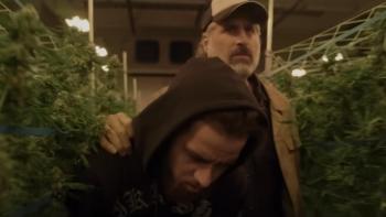 Clika Movie: A man in a cap and white beard shoves Chito through a crop of marijuana plants