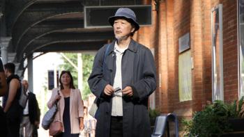 Cottontail: Lily Franky stands at a train station, holding a ticket and looking confused