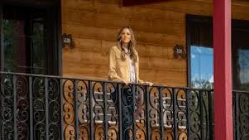 A Cowboy Christmas Romance: Jana Kramer stands on balcony