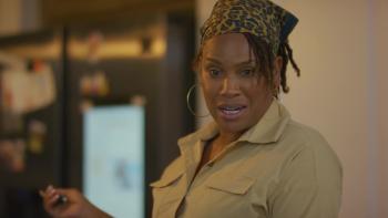 Crescent Gang scene 1: A woman wearing an animal print bandanna and khaki shirt appears to be in the middle of an angry tirade.