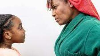 Crescent Gang scene 2: A woman glares at a child with her arms crossed