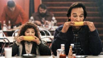 Curly Sue Movie: Bill and Curly Sue eating corn on the cob in a diner.