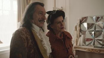 Daliland Movie: An older Salvador Dali and his wife dressed in coats inside an art studio