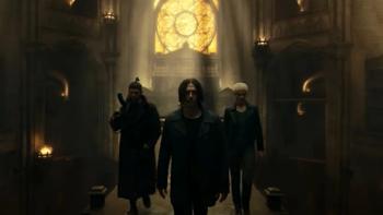 Dampyr: Two White men and one White woman walk through a dimly-lit ancient building