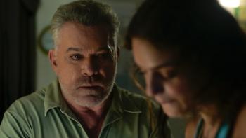 Dangerous Waters Movie: The Captain (Ray Liotta), looking sinister, speaks to Rose, who is out of focus on the right
