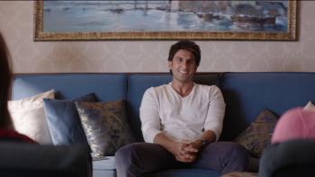 Dil Dhadakne Do: A young Indian man laughs while talking to his parents.