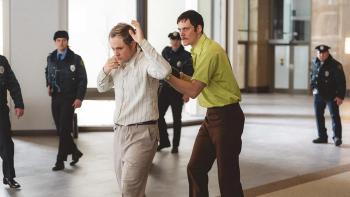 Dead Man's Wire movie: Tony Kiritsis (Bill Skargard) holds a shotgun to the head of the head of a mortgage lender (Dacre Montgomery)