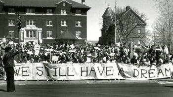 Deaf President Now!: Student protestors hold a banner.