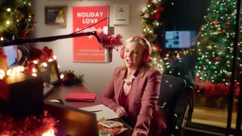 Dear Christmas: Melissa Joan Hart sits in front of a microphone and recording equipment, surrounded by Christmas decorations