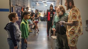 Dear Santa movie: Two 11-year-old boys stand backstage with a happy Post Malone and Jack Black