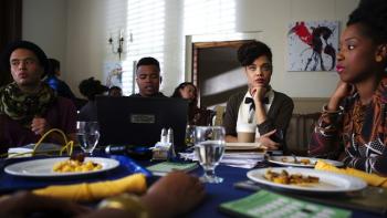 Dear White People movie: A group of students gather around a dining hall table, looking bored