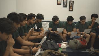 Deepfaking Sam Altman Movie: In India, nine seated young men prepare to audition for the role of "Sambot"