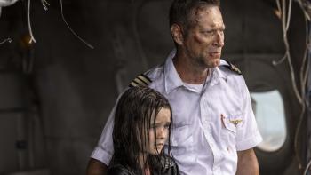 Deep Water Movie: First officer Ben (Aaron Eckhart) stands with young Cora (Molly Wright) on the floating plane wreckage