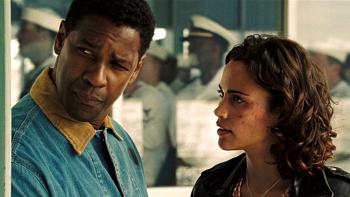 Deja Vu Movie: Denzel Washington looks askance as Paula Patton, with scrapes on her face, talks intently at him