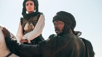 Desert Warrior Movie: Princess Hind, on horseback, and the Bandit, on foot, seem to spy something in the distance