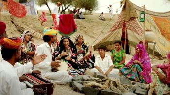 Rainbow: Characters perform Indian folk music in the desert