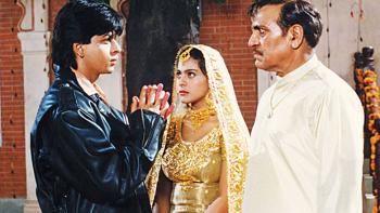 Dilwale Dulhania Le Jayenge: Kajol and Shah Rukh Khan as a young couple, with Amrish Puri as a stern father 