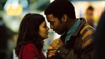 Dirty Pretty Things: Audrey Tautou and Chiwetel Ejiofor clasp hands and look earnestly into each other's eyes