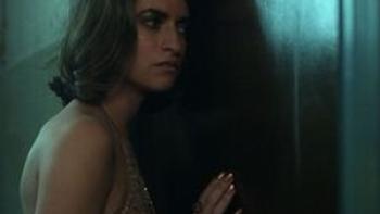 Disco Inferno scene 1: Woman leans into a door