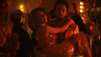 Disco Inferno scene 2: A man holds a woman in his arms
