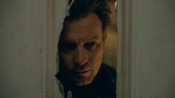 Doctor Sleep Movie: Danny stares through the hole in the door made by his father