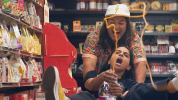 Doin' It Movie: Two friends on the ground, squeezing something out of a bottle