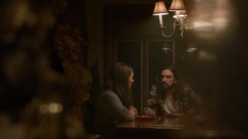 Dream Eater Movie: Mallory and Alex sit at a table, having what appears to be a serious talk
