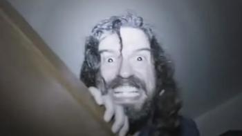 Dream Eater Movie: Alex's face, looking enraged and wild, appears over the staircase bannister