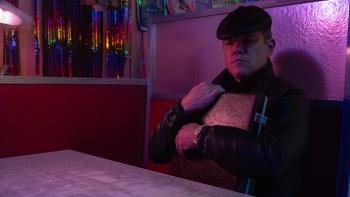 Drive-Away Dolls: Senator Gary Channel sits in a diner booth, clutching an attache case to his chest