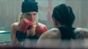 Duchess: Charlotte Kirk holds her fists up in front of her in a boxing ring, her opponent seen from behind