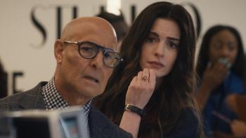 The Devil Wears Prada 2 movie: Stanley Tucci and Anne Hathaway peer at something