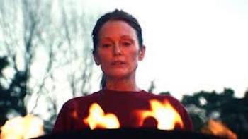 Echo Valley: Julianne Moore stands over a fire.