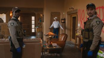 Eddington Movie: Joe Cross (center) and two officers (Micheal Ward, left, and Luke Grimes, right) investigate a crime scene