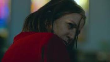 Elena Knows scene 3: Woman in red looks over her shoulder