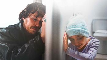 Elijah Peel movie: Malcolm Cumming and Evelyn Grace Kite reach toward each other through a bathroom door