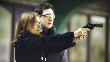 Elle Movie: Michele shoots a gun with Patrick